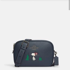 NWT Coach X Peanuts Tamie Camera Bag
With Snoopy Ski Motif